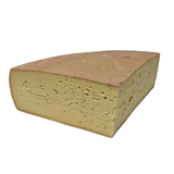 Quarter wheel of raclette cheese with pepper corn