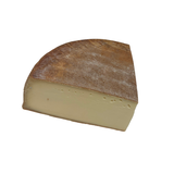 Quarter wheel of smoked raclette cheese