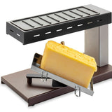 Raclette Melter with grill top with cheese ready to scrape cheese